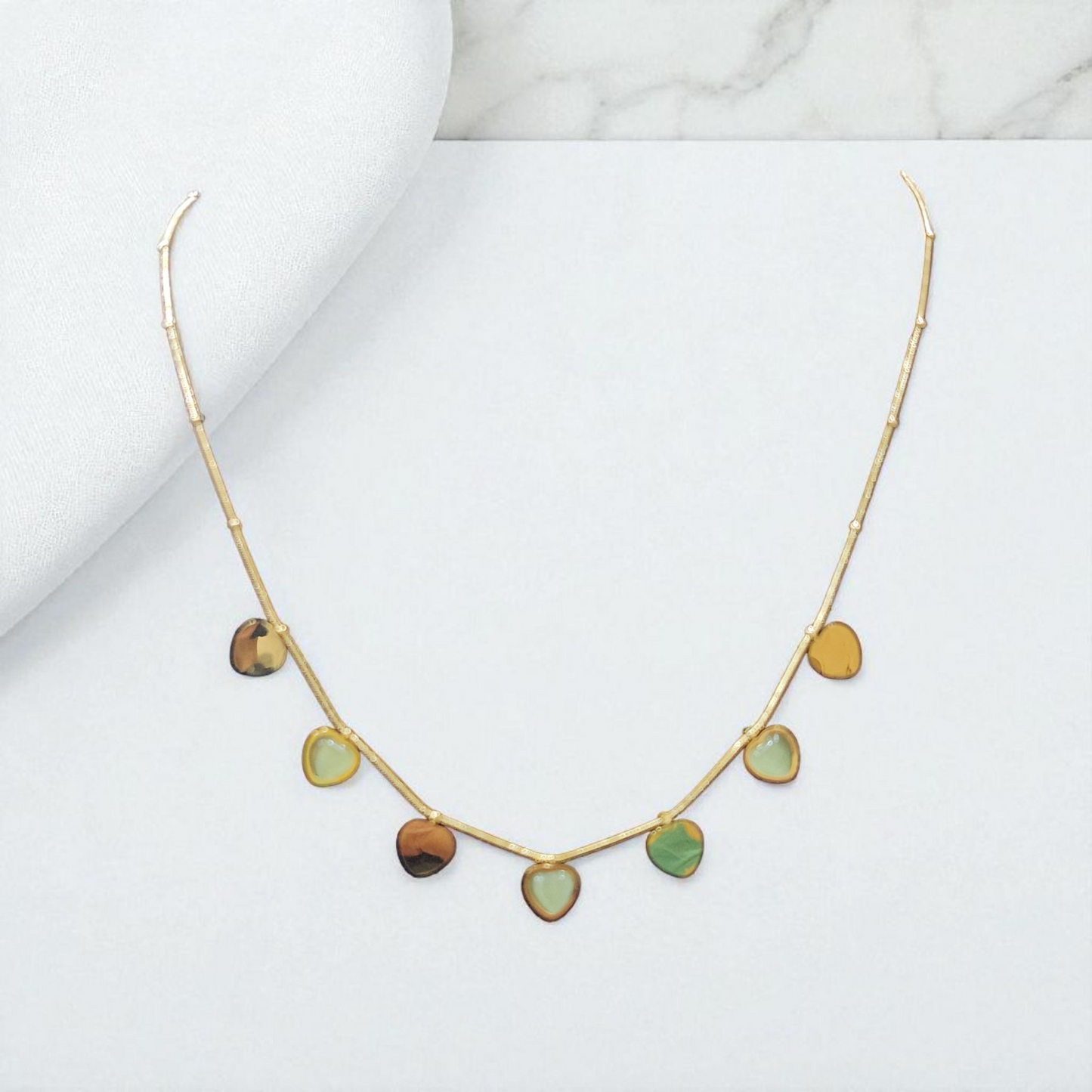 Anti tarnish Charm Necklace with Heart Shaped Green Stone Accents