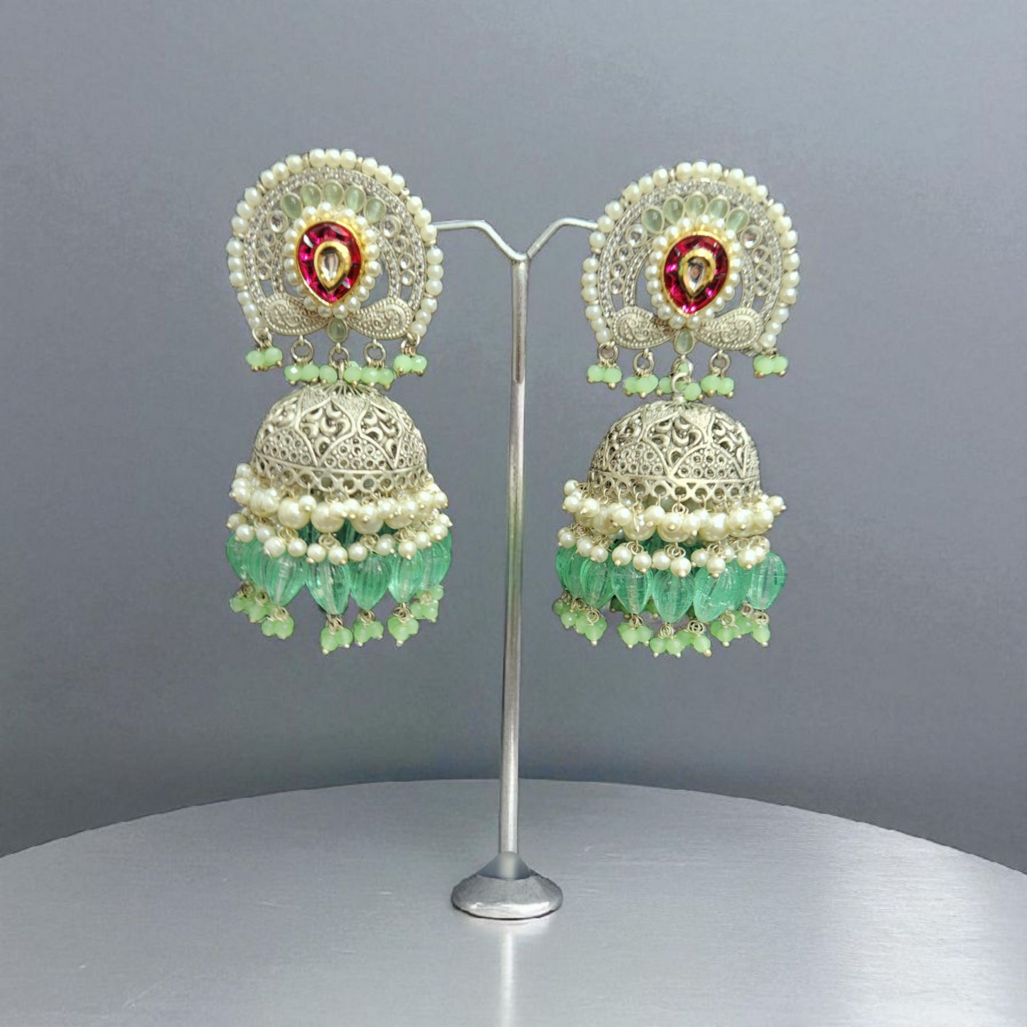 Silver -Plated peacock Jhumka Earrings with Green Beads & Pearl Detailing