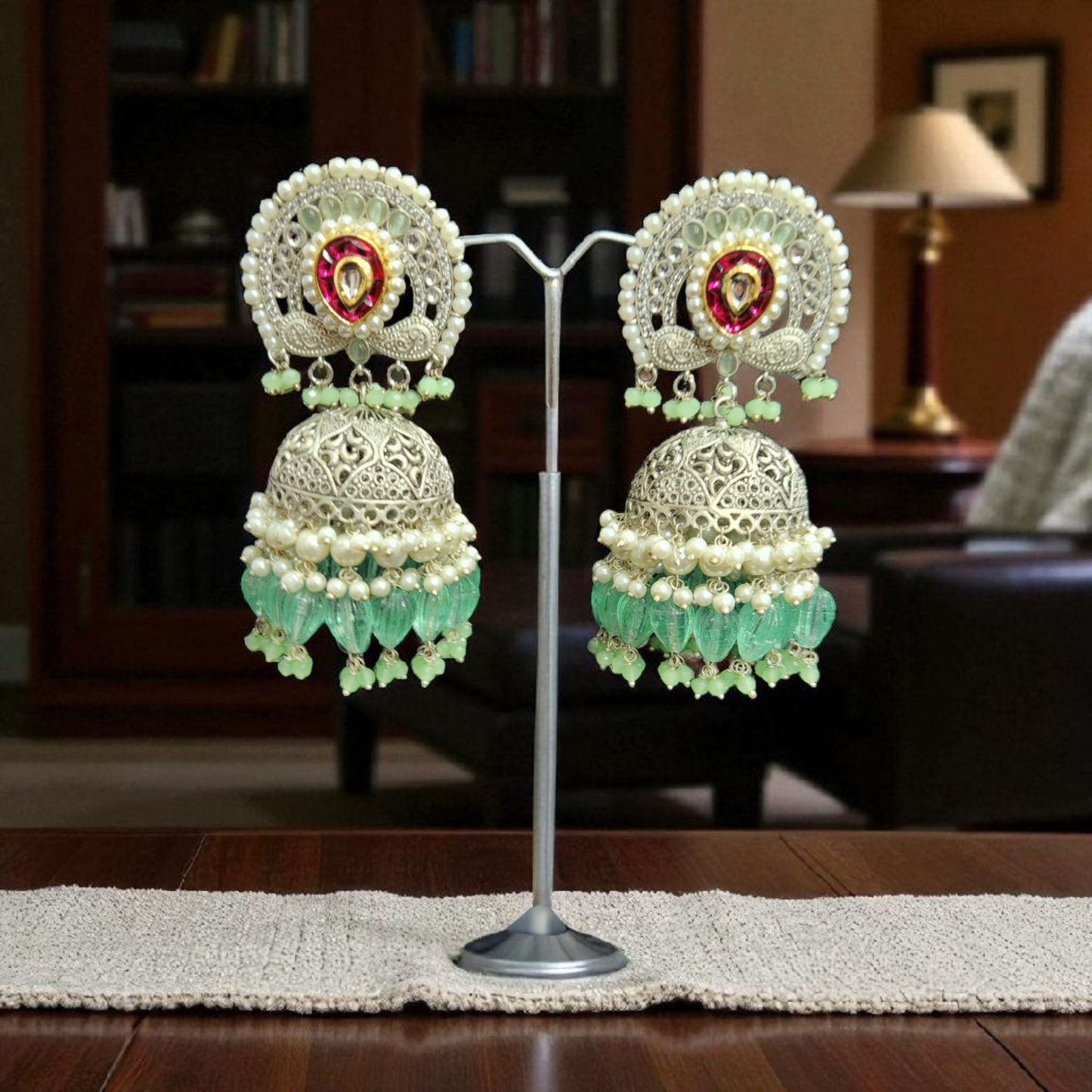 Silver -Plated peacock Jhumka Earrings with Green Beads & Pearl Detailing